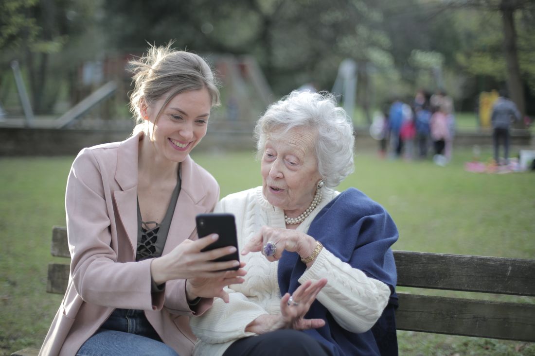 Older mother and adult daughter together. Illustrative stock photograph